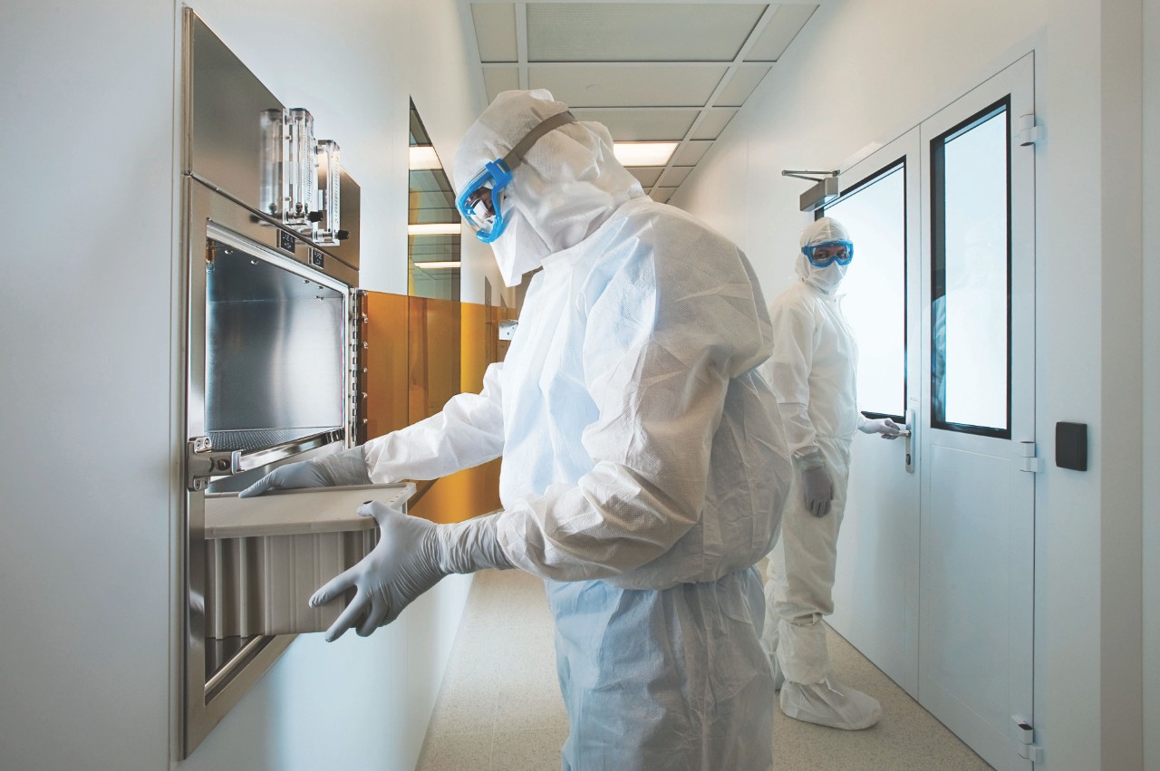 Scientists cleaning laboratory apparel